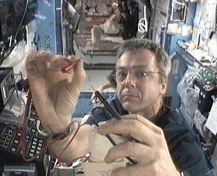 160328main_cdra Expedition 20 Flight Engineer Bob Thirsk works on the Carbon Dioxide Removal Assembly in the Destiny laboratory. Photo credit: NASA TV