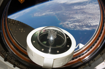 160328main_iss020e014200 A moon rock brought to Earth by Apollo 11, humans' first landing on the moon in July 1969, floats aboard the International Space Station. Credit: NASA
