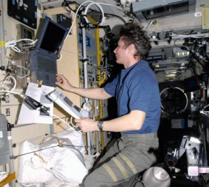 160328main_iss020e020243 Expedition 20 Commander Gennady Padalka uses a computer in the Zvezda service module of the International Space Station. Credit: NASA