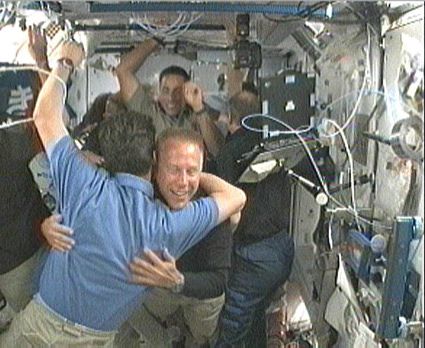 160328main_sts127hatch The Expedition 20 and STS-127 crews greet each other after the hatches between the two vehicles were opened. Credit: NASA TV