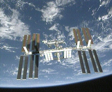 160328main_undock The shadow of space shuttle Endeavour can be seen on the International Space Station's solar arrays shortly after undocking. Photo credit: NASA TV