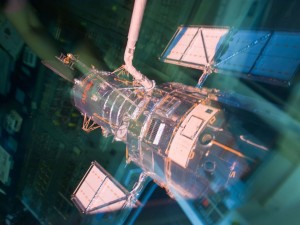 350857main_image_1368_1024-768 The Hubble Space Telescope is pictured through an overhead window on the aft flight deck of the Earth-orbiting space shuttle Atlantis immediately prior to its release on flight day 9, May 19, 2009. Image Credit: NASA