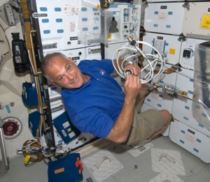 368958main_s127e005141 Astronaut Dave Wolf, STS-127 mission specialist, works on the middeck of space shuttle Endeavour during flight day one activities. Photo credit: NASA