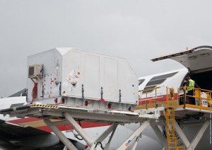 614_lg Optus D3 is unloaded from a chartered jetliner that airlifted the Orbital Sciences Corporation-built payload from its U.S. manufacturing facility to Cayenne’s Rochambeau International Airport.