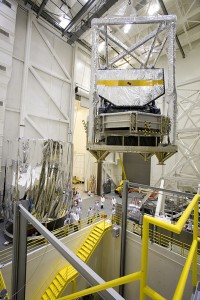 JWST7060 JWST model core is shown being lowered into a staging area, where the gaseous helium shroud (shown at left of picture) will be draped over the core before it is installed into the thermal vacuum chamber.