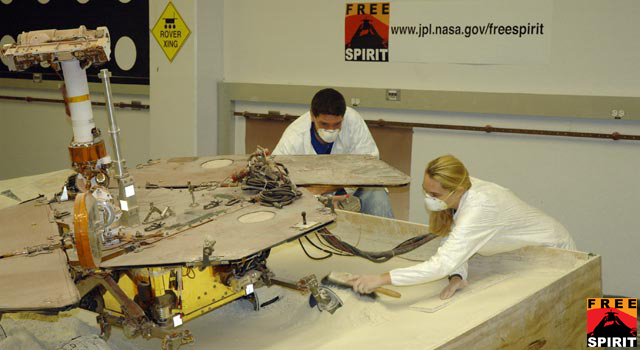 mer20090729-browse Mars Exploration Rover team members continued longer-duration test runs this week, driving the test rover forward and uphill in a crab-like position. Pictured are Matt Van Kirk with Sharon Laubach.