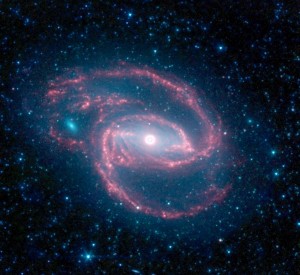 ssc2009-14a1 NASA's Spitzer Space Telescope has imaged a wild creature of the dark -- a coiled galaxy with an eye-like object at its center. Credit: NASA