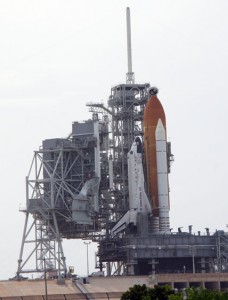 153212main_rss-428 On Launch Pad 39A, workers move the Rotating Service Structure, or RSS, around space shuttle Discovery in order to replace the Tyvek covers protecting the shuttle's nose thrusters. Photo credit: NASA