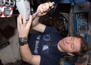 160328main_iss020e032855 Expedition 20 Flight Engineer Michael Barratt works with the Lab-on-a-Chip Application Development-Portable Test System experiment in the Destiny laboratory of the International Space Station. Credit: NASA