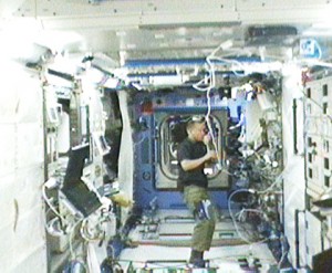 160328main_station_082109 Expedition 20 Flight Engineer Tim Kopra sets up a Japanese life sciences experiment in the International Space Station’s Kibo laboratory. Credit: NASA TV