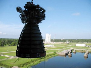 380784main_CLT-09-127 Space shuttle main engine No. 0525 is lifted from the A-2 Test Stand at Stennis Space Center on Aug. 17, as the new A-3 Test Stand under construction is seen in the background.
