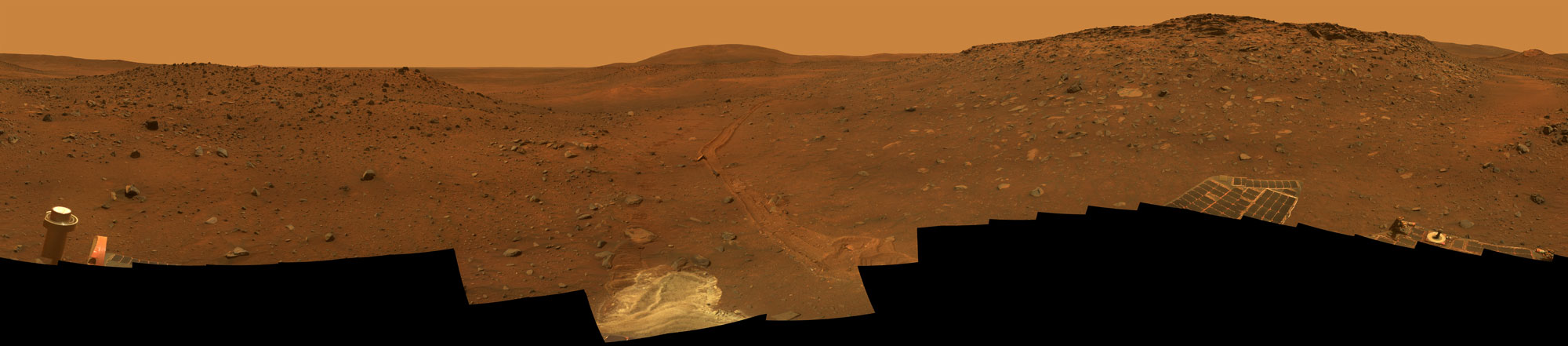 381426main_mer-20090826-ful This full-circle view from the panoramic camera (Pancam) on NASA's Mars Exploration Rover Spirit shows the terrain surrounding the location called "Troy," where Spirit became embedded in soft soil during the spring of 2009.