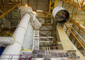 617_lg the ESC-A upper stage/vehicle equipment bay unit is moved toward Ariane 5 for its installation atop the launcher’s core stage