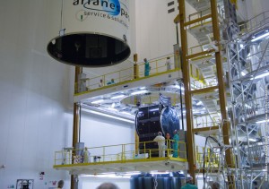 621_2_lg The Ariane 5 payload fairing is readied to be lowered over JCSAT-12 and the SYLDA dispenser in the launcher Final Assembly Building.
