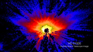 Warped0001 The inner, yellow portion of HD 61005's disk spans 5.4 billion miles, or about the width of Neptune's orbit in our own solar system. This false-color Hubble view masks the star's direct light to bring out detail in the disk. Credit: NASA