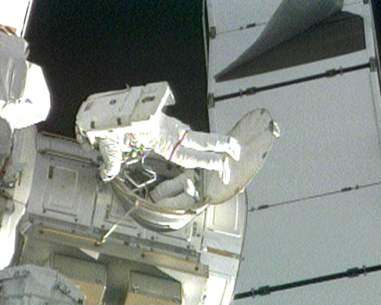 160328main_425x340 Astronauts Danny Olivas and Nicole Stott exit the Quest airlock to begin the first spacewalk of the STS-128 mission. Credit: NASA TV