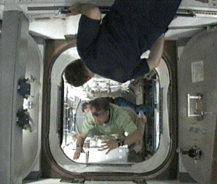160328main_425x360 Crew members take a look inside the Leonardo Multi-Purpose Logistics Module (MPLM) shortly after hatch opening. Credit: NASA TV