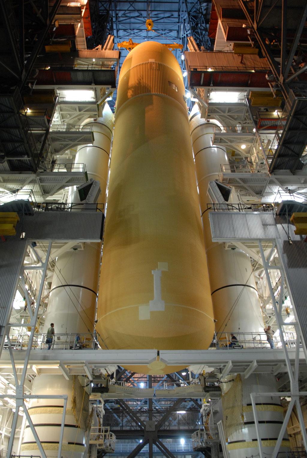 180842main_stack The external fuel tank for space shuttle Atlantis' STS-129 mission is lowered between the solid rocket boosters stacked on the mobile launch platform in high bay 2 of NASA's Kennedy Space Center in Florida. Credit: NASA/Jim Grossmann