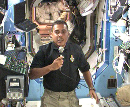 382012main_425x349 STS-128 Mission Specialist Jose Hernandez participates in an interview with Univision while aboard the International Space Station. Photo credit: NASA TV