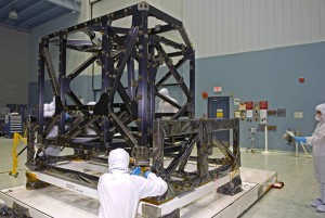 386549main_webb_shape_cleanroom_HI NASA engineers check out the unwrapped ISIM structure in a clean room. The ISIM Structure supports and holds four Webb telescope science instruments. Credit: NASA, Chris Gunn