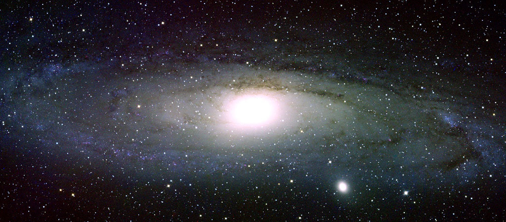 386912main_Swift_M31_large_optical This optical view from a ground-based telescope shows the Andromeda Galaxy in a more familiar light. Credit:NASA