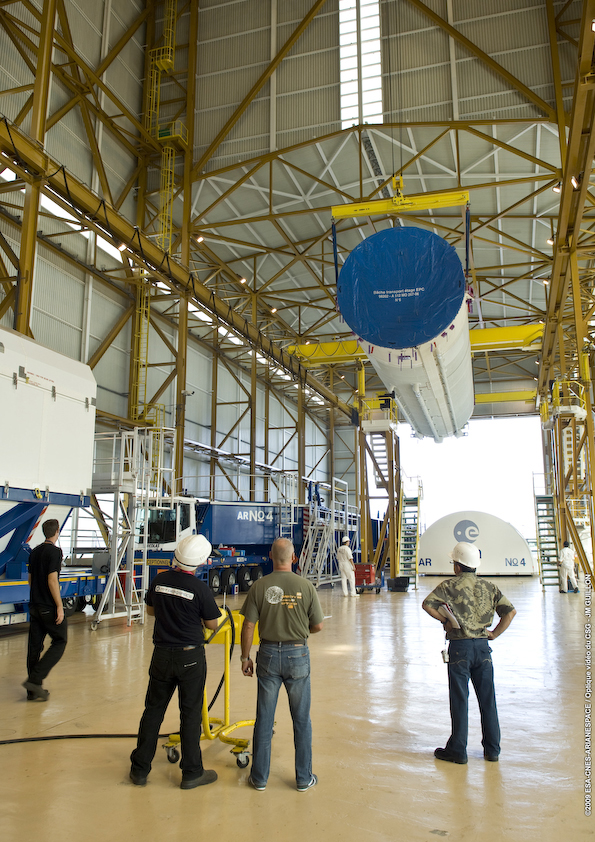 Destockage EPC Mission team members use an overhead crane to remove the Ariane 5’s cryogenic core stage from its shipping container. This is the first step in each new launch campaign for Ariane 5, and it the marks the assembly process start-up for the sixth heavy-lift vehicle to be used by Arianespace in 2009.