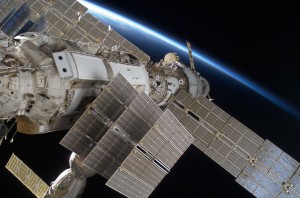 Part of the ISS backdropped by the limb of Earth. Credit: NASA