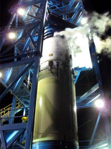 20091005_2ndstage A Falcon 9 second stage mounted on a Falcon 9 interstage vents vapor from its liquid oxygen tank during acceptance testing at SpaceX's Texas Test Site outside of Waco.