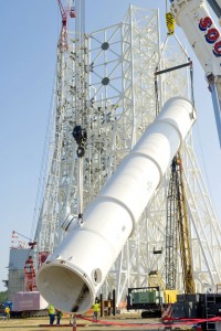 390778main_CLT-09-147_5 A 39,000-gallon water tank is lifted into place at the A-3 Test Stand construction site at Stennis Space Center.