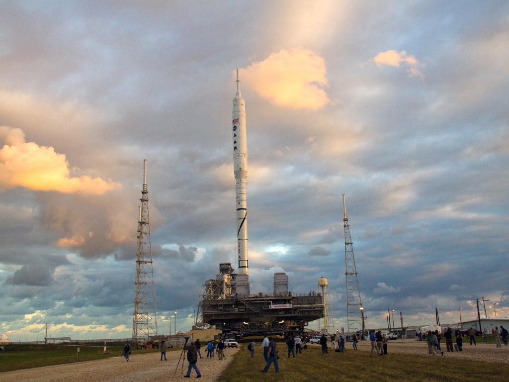 As the sun rises over Launch Pad 39B at NASA's Kennedy Space Center in Florida, the 327-foot-tall Ares I-X rocket, secured to a mobile launcher platform, prepares to climb the five percent grade of the crawlerway to the top of the pad. Credit: NASA As the sun rises over Launch Pad 39B at NASA's Kennedy Space Center in Florida, the 327-foot-tall Ares I-X rocket, secured to a mobile launcher platform, prepares to climb the five percent grade of the crawlerway to the top of the pad. Credit: NASA