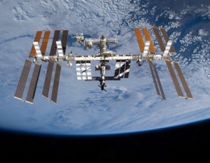 160328main_iss_thanksgiving Set against a background of clouds, the International Space Station is seen from space shuttle Atlantis after undocking. Photo credit: NASA