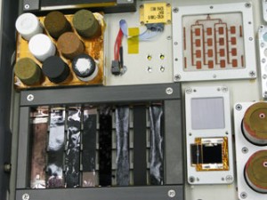 Space Shuttle Atlantis will next week carry a new Rensselaer nanomaterials experiment to the International Space Station. Samples of novel nanocomposite materials, seen in the photo, will be mounted to the hull of the space station, and tested to see how they weather the perils of space. Space Shuttle Atlantis will next week carry a new Rensselaer nanomaterials experiment to the International Space Station. Samples of novel nanocomposite materials, seen in the photo, will be mounted to the hull of the space station, and tested to see how they weather the perils of space.