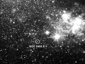 This archival image taken by the Hubble Space Telescope shows the location of NGC 5408's unusually luminous X-ray source (circled). The irregular-type galaxy lies 15.8 million light-years away in the constellation Centaurus. Credit: NASA/ESA/C. Lang, P. Kaaret, A. Mercer (Univ. of Iowa), and S. Corbel (Univ. of Paris) This archival image taken by the Hubble Space Telescope shows the location of NGC 5408's unusually luminous X-ray source (circled). The irregular-type galaxy lies 15.8 million light-years away in the constellation Centaurus. Credit: NASA/ESA/C. Lang, P. Kaaret, A. Mercer (Univ. of Iowa), and S. Corbel (Univ. of Paris)
