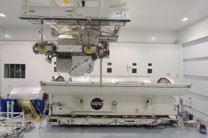 402224main_ELC2_insertion_at_KSC_3000 In the Space Station Processing Facility at NASA's Kennedy Space Center in Florida, workers position the ExPRESS Logistics Carrier-2, or ELC-2, over a transportation canister where it will be secured for its trip to Launch Pad 39A. Once at the pad, it will be installed in the payload bay of Space Shuttle Atlantis Credit: NASA/Goddard/Orbital Sciences Corporation