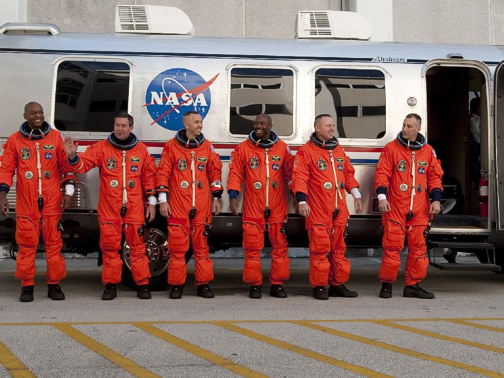 STS-129 crew members, from left, Robert Satcher, Mike Foreman, Randy Bresnik, Leland Melvin, Pilot Barry Wilmore and Mission Commander Charlie Hobaugh pose for a photograph before getting into the astrovan and heading to Launch Pad 39A. Credit: NASA/Bill Ingall STS-129 crew members, from left, Robert Satcher, Mike Foreman, Randy Bresnik, Leland Melvin, Pilot Barry Wilmore and Mission Commander Charlie Hobaugh pose for a photograph before getting into the astrovan and heading to Launch Pad 39A. Credit: NASA/Bill Ingall