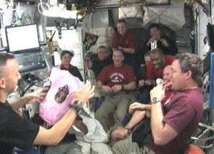 Mission Specialist Randy Bresnik (far left) and the STS-129 and Expedition 21 crews celebrate the birth of his daughter. Credit: NASA TV Mission Specialist Randy Bresnik (far left) and the STS-129 and Expedition 21 crews celebrate the birth of his daughter. Credit: NASA TV