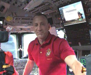 403499main_sts-129-2009-11-17 In this view is Commander Charles Hobaugh on the flight deck of space shuttle Atlantis. Photo credit: NASA TV
