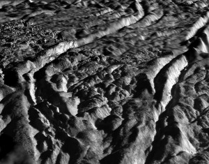 A perspective view of Baghdad Sulcus, one of several prominent linear structures, dubbed 'tiger stripes,' within the geologically active south polar region of Enceladus. Credit: NASA/JPL A perspective view of Baghdad Sulcus, one of several prominent linear structures, dubbed 'tiger stripes,' within the geologically active south polar region of Enceladus. Credit: NASA/JPL