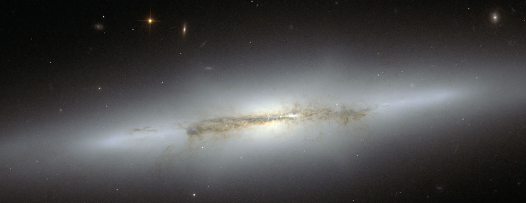 The evolution of the bulges in spiral galaxies led astronomers to the edge-on galaxy NGC 4710. Credit: ESA/NASA The evolution of the bulges in spiral galaxies led astronomers to the edge-on galaxy NGC 4710. Credit: ESA/NASA