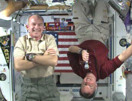 Commander Jeff Williams (left) and Flight Engineer T.J. Creamer talk to U.S. service members stationed in Baghdad. Credit: NASA TV Commander Jeff Williams (left) and Flight Engineer T.J. Creamer talk to U.S. service members stationed in Baghdad. Credit: NASA TV