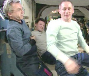 160328main_exp21_farewell From left are Expedition 21 crew members Robert Thirsk, Roman Romanenko and Frank De Winne. The departing crew had just bid farewell to all the international control centers supporting station operations. Credit: NASA TV