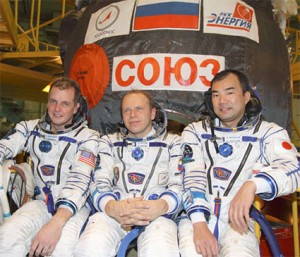 160328main_jsc2009e258623_small The newest Expedition 22 crew members from left are, T.J. Creamer, Oleg Kotov and Soichi Noguchi. Behind them is the Soyuz TMA-17 spacecraft they will ride in on their flight to the space station. Credit: NASA/Victor Zelentsov