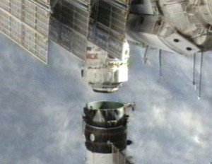 160328main_propmod-1 Poisk's propulsion compartment, seen at the bottom of this camera view, undocks and moves away from the International Space Station on Monday. Credit: NASA TV