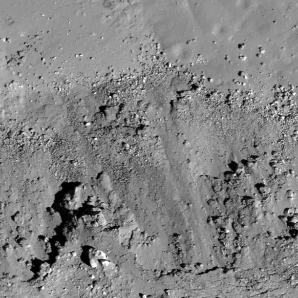 This image is showing landslides (bottom) covering impact melt on the floor (top) of a fresh Copernican-age crater at the edge of Oceanus Procellarum and west of Balboa crater. Image width is 550 meters. Credit:NASA This image is showing landslides (bottom) covering impact melt on the floor (top) of a fresh Copernican-age crater at the edge of Oceanus Procellarum and west of Balboa crater. Image width is 550 meters. Credit:NASA