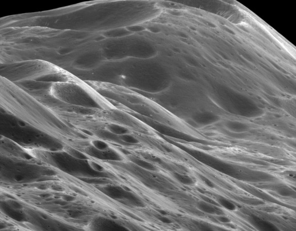This stunning close-up shows mountainous terrain reaching about 10 km in height along the unique equatorial ridge of Iapetus. The view was acquired during Cassini's only close flyby of the two-toned Saturn moon. Credits: NASA/ JPL This stunning close-up shows mountainous terrain reaching about 10 km in height along the unique equatorial ridge of Iapetus. The view was acquired during Cassini's only close flyby of the two-toned Saturn moon. Credits: NASA/ JPL