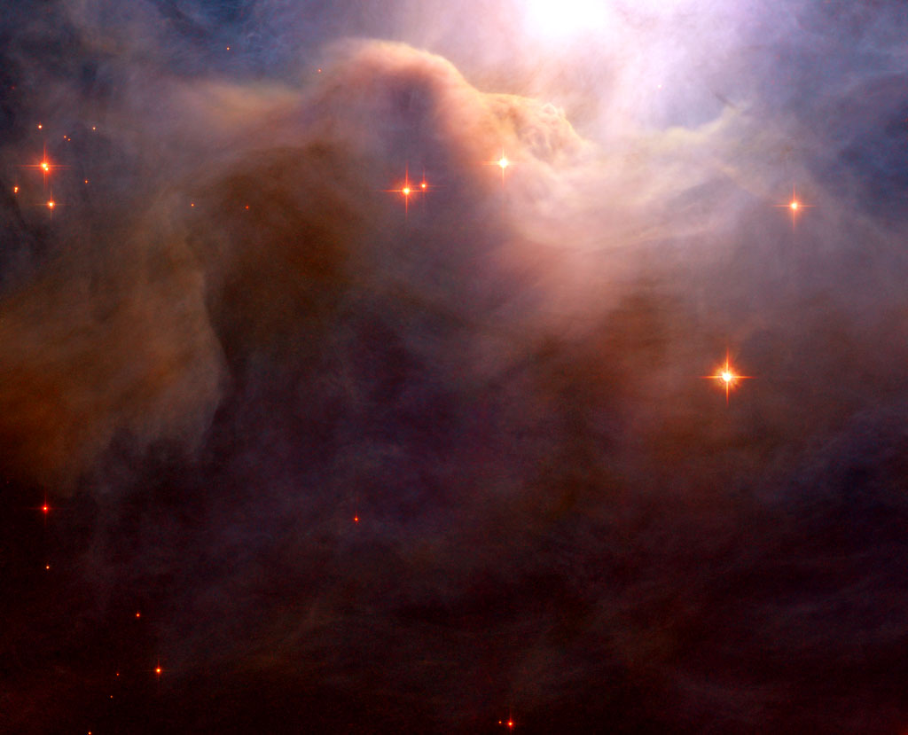 This close-up of an area in the northwest region of the large Iris Nebula seems to be clogged with cosmic dust. Credit: NASA ,ESA This close-up of an area in the northwest region of the large Iris Nebula seems to be clogged with cosmic dust. Credit: NASA ,ESA