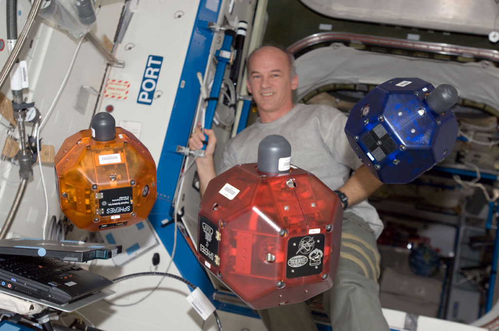Expedition 22 Commander Jeff Williams performs a check of the Synchronized Position Hold, Engage, Reorient, Experimental Satellites (SPHERES) experiment in the Destiny laboratory of the International Space Station. Credit: NASA Expedition 22 Commander Jeff Williams performs a check of the Synchronized Position Hold, Engage, Reorient, Experimental Satellites (SPHERES) experiment in the Destiny laboratory of the International Space Station. Credit: NASA