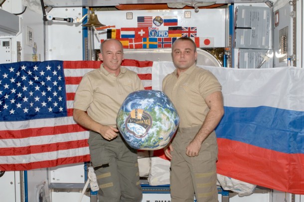 ommander Jeff Williams (left) and Flight Engineer Maxim Suraev hold a globe with the Expedition 22 logo in the Harmony node of the International Space Station. Photo credit: NASA ommander Jeff Williams (left) and Flight Engineer Maxim Suraev hold a globe with the Expedition 22 logo in the Harmony node of the International Space Station. Photo credit: NASA