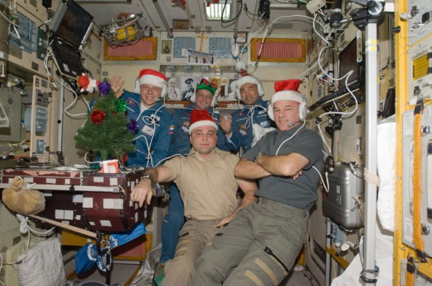 Wearing festive holiday hats, the Expedition 22 crew speaks with officials from Russia, Japan and the United States. In the front row are Flight Engineer Maxim Suraev (left) and Commander Jeff Williams. Behind them, left to right, are newly-arrived Flight Engineers Oleg Kotov, T.J. Creamer and Soichi Noguchi. Credit: NASA Wearing festive holiday hats, the Expedition 22 crew speaks with officials from Russia, Japan and the United States. In the front row are Flight Engineer Maxim Suraev (left) and Commander Jeff Williams. Behind them, left to right, are newly-arrived Flight Engineers Oleg Kotov, T.J. Creamer and Soichi Noguchi. Credit: NASA