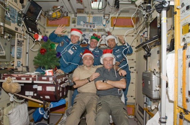 Wearing festive holiday hats, the Expedition 22 crew speaks with officials from Russia, Japan and the United States. In the front row are Flight Engineer Maxim Suraev (left) and Commander Jeff Williams. Behind them, left to right, are newly-arrived Flight Engineers Oleg Kotov, T.J. Creamer and Soichi Noguchi. Credit: NASA Wearing festive holiday hats, the Expedition 22 crew speaks with officials from Russia, Japan and the United States. In the front row are Flight Engineer Maxim Suraev (left) and Commander Jeff Williams. Behind them, left to right, are newly-arrived Flight Engineers Oleg Kotov, T.J. Creamer and Soichi Noguchi. Credit: NASA